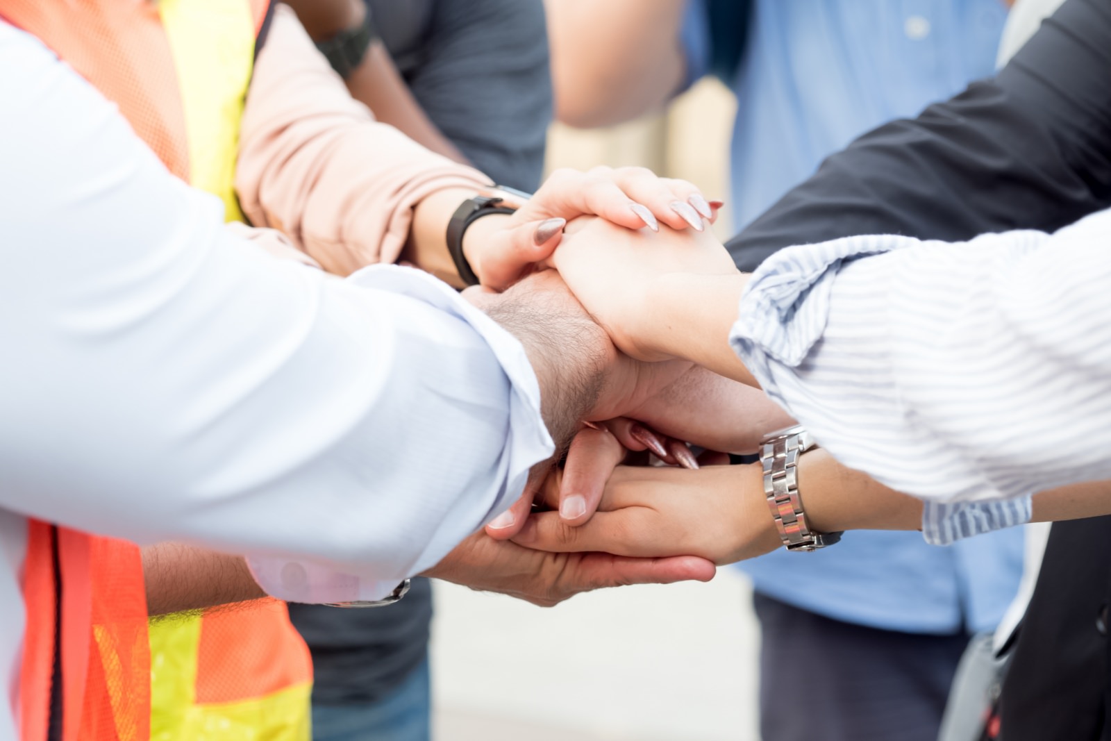 People putting their hands together